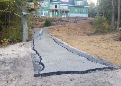 worker creating new driveway